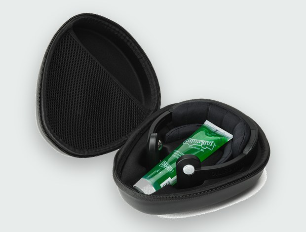 Pulsetto carry case open, with the device and a tube of conductive electrode gel inside